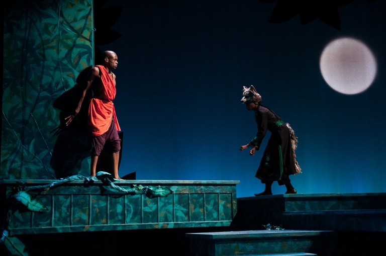 Mowgli is greeted by the wolf pack - The Jungle Book at IStage